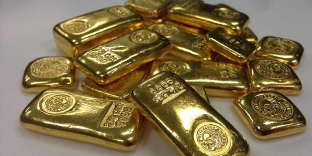 Doların güçlenmesiyle ons altın geriledi