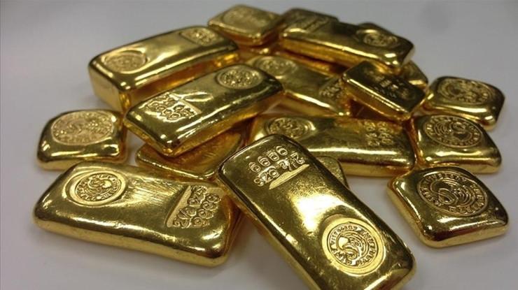 Doların güçlenmesiyle ons altın geriledi
